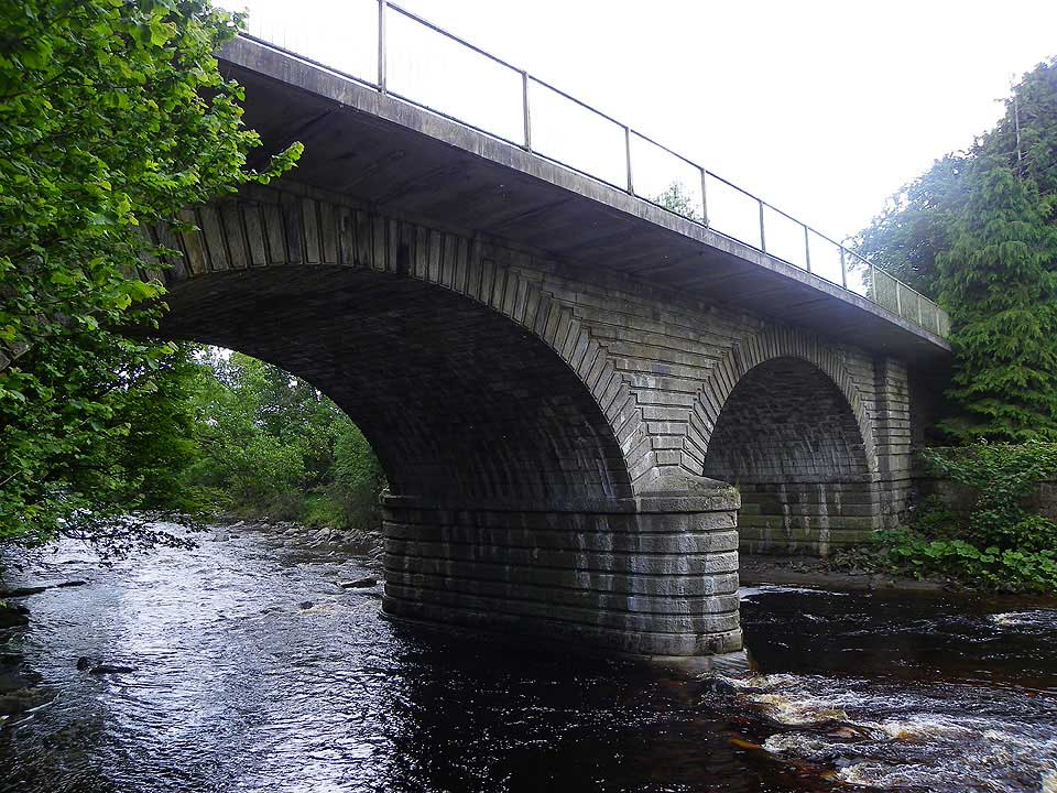 Brewery Bridge crossing the River South Tyne close to the site